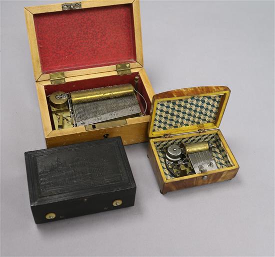 Three musical boxes, one in a tortoiseshell box